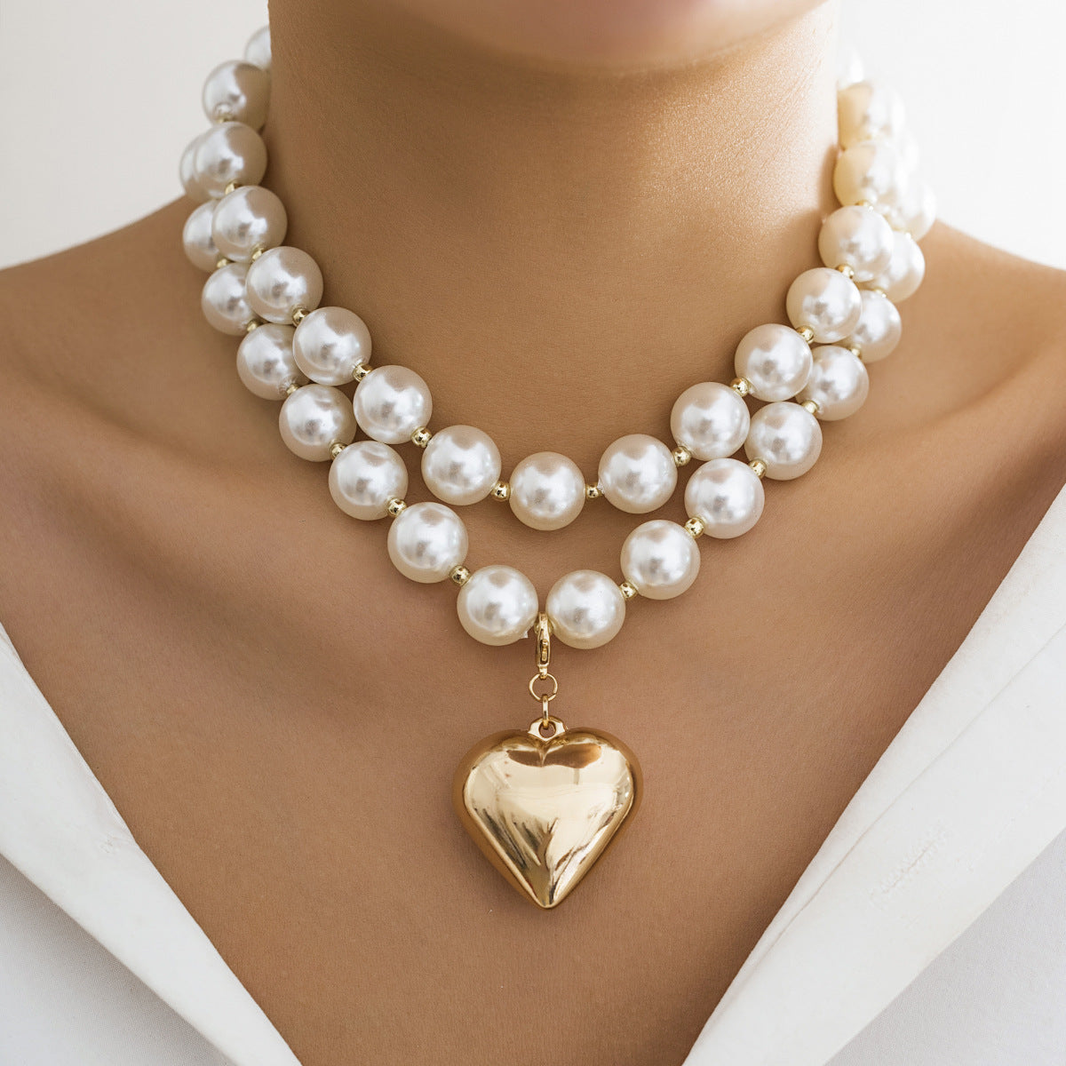 pearl beaded necklace with golden heart