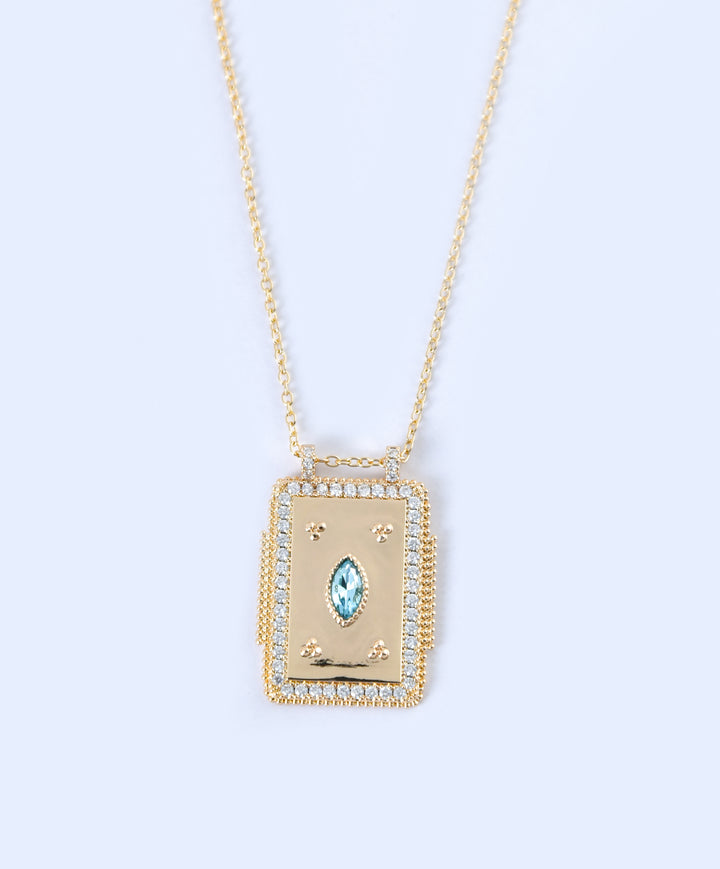 Golden Pendant with Blue Zircon