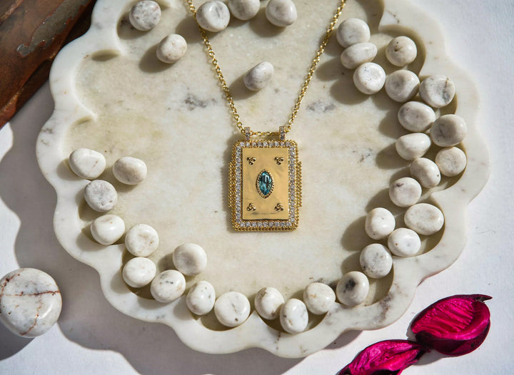 Golden Pendant with Blue Zircon