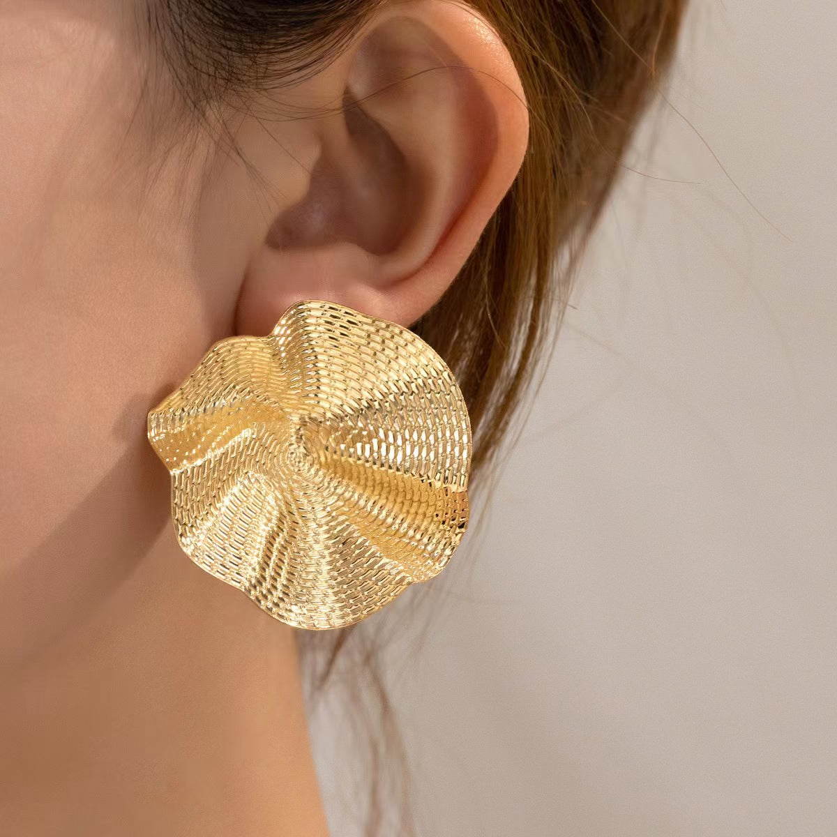 Golden round earring
