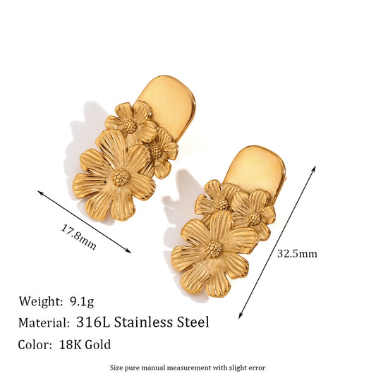 Golden earrings with embossed flower