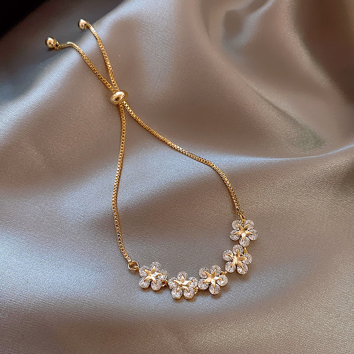 Floral zirconia gold bracelet