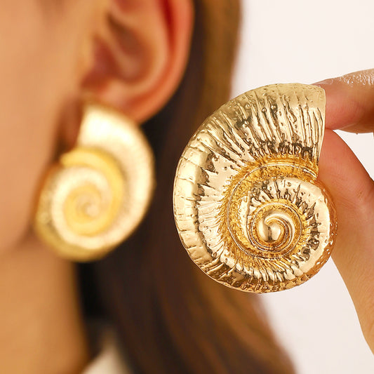 Golden big twirl earrings